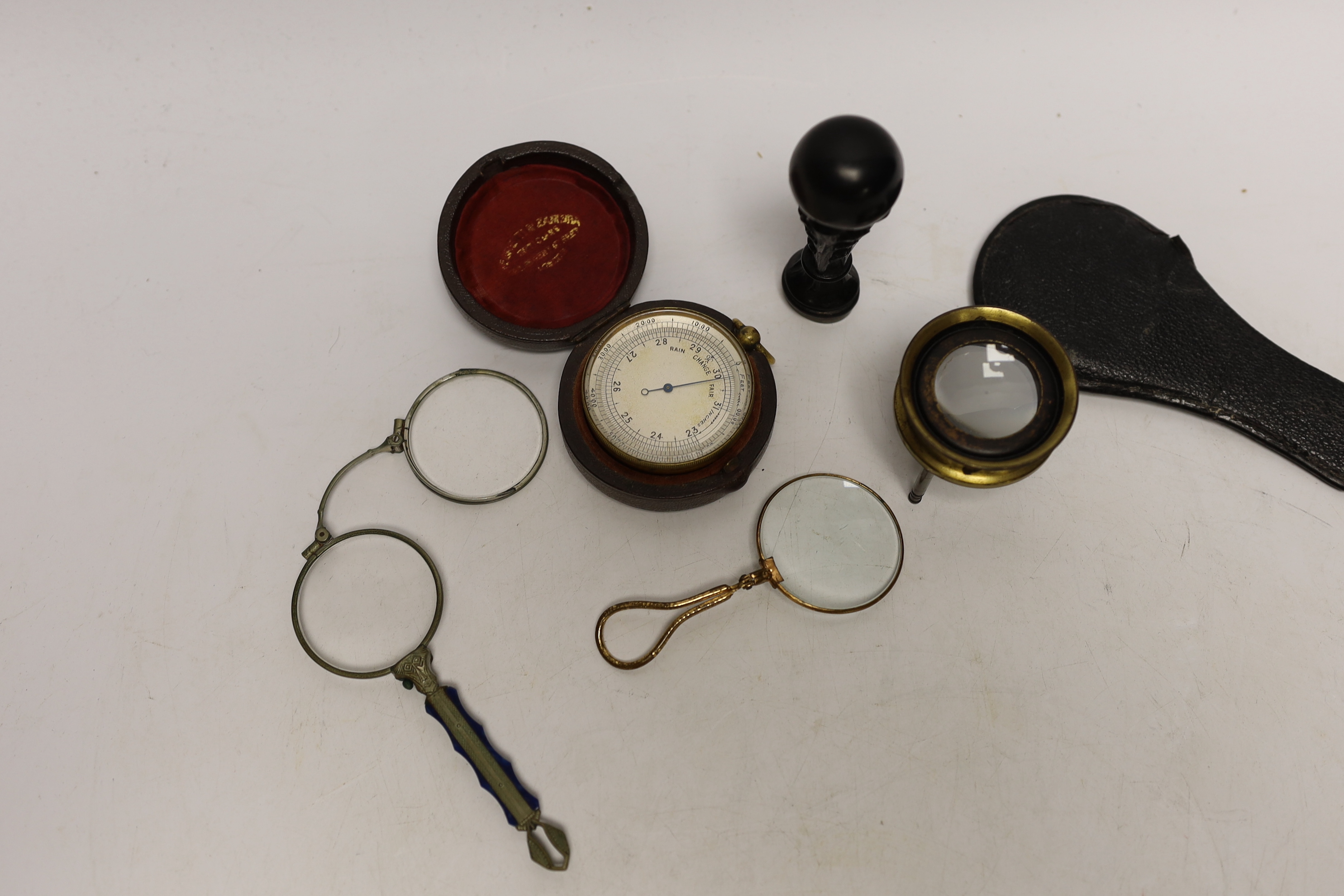 A pocket barometer, carved wood ‘stag head’ seal, lorgnette and eyeglass